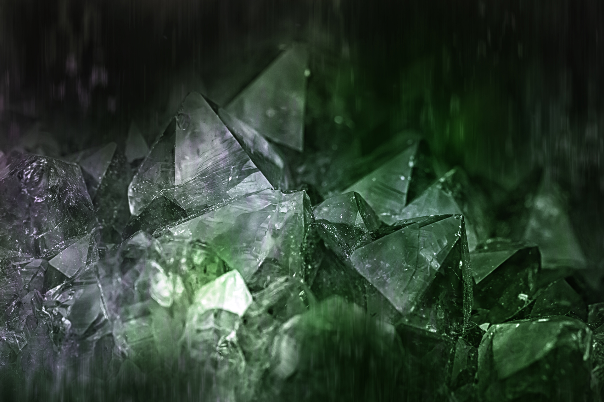 Green emerald gemstone background close up.