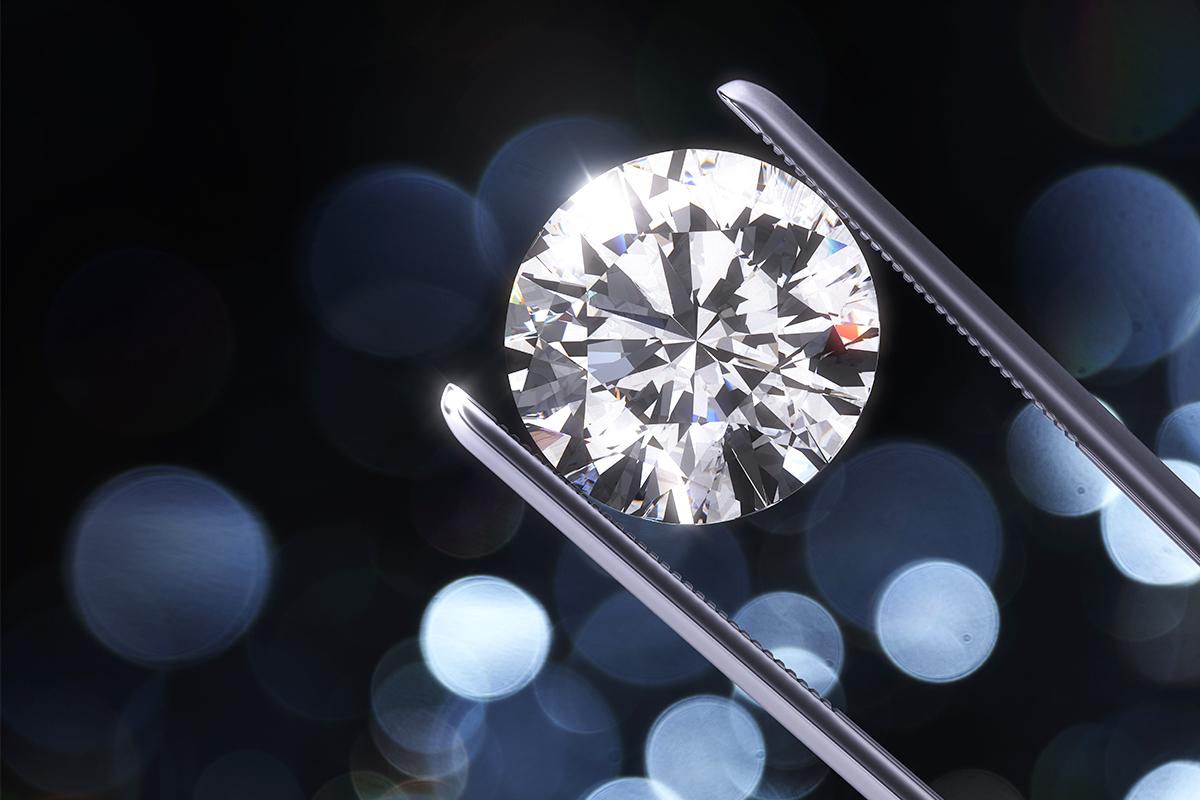 Luxury diamond in tweezers