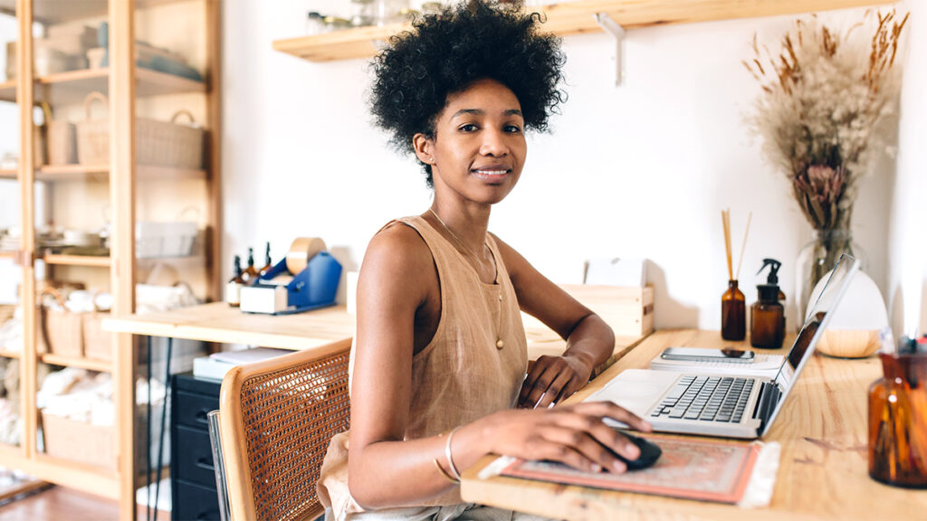 Female business owner working on laptop